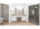 Double vanity bathroom with granite counters and tile floors at 730 Pinehurst Dr, Fairburn, GA 30213