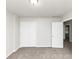 Bright bedroom with neutral walls and carpet, offering ample closet space at 730 Pinehurst Dr, Fairburn, GA 30213