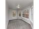 Bright bedroom with grey carpet and multiple windows at 730 Pinehurst Dr, Fairburn, GA 30213