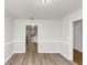 Spacious dining room with hardwood floors and access to kitchen at 730 Pinehurst Dr, Fairburn, GA 30213