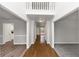 Bright and spacious entryway with hardwood floors and neutral paint at 730 Pinehurst Dr, Fairburn, GA 30213