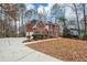 Two-story house with driveway, landscaping, and a large backyard at 730 Pinehurst Dr, Fairburn, GA 30213