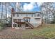 Two story house with wooden deck and backyard at 730 Pinehurst Dr, Fairburn, GA 30213