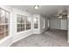 Main bedroom with grey carpet and multiple windows at 730 Pinehurst Dr, Fairburn, GA 30213