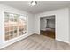 Home office with large window, neutral carpeting and hardwood floors at 730 Pinehurst Dr, Fairburn, GA 30213
