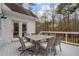 Inviting backyard deck with an outdoor dining table and seating for relaxed entertaining at 1109 Wiley Bridge Rd, Woodstock, GA 30188