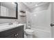 Updated bathroom featuring a single vanity with a shower-tub combination, providing a clean and modern space at 1109 Wiley Bridge Rd, Woodstock, GA 30188