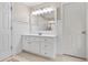 Bathroom with white cabinets, sink and large mirror at 1109 Wiley Bridge Rd, Woodstock, GA 30188