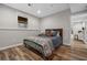 Serene bedroom with natural light, hardwood floors, and a comfortable atmosphere at 1109 Wiley Bridge Rd, Woodstock, GA 30188