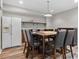 Basement dining area features a stainless steel refrigerator, counter space and chairs at 1109 Wiley Bridge Rd, Woodstock, GA 30188