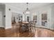 Charming dining area featuring a round table and an elegant chandelier, with access to outdoor deck at 1109 Wiley Bridge Rd, Woodstock, GA 30188