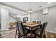 Charming dining room with wood floors, modern lighting, and a view to the lower level at 1109 Wiley Bridge Rd, Woodstock, GA 30188