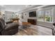 Inviting living room area with large windows for natural light and hardwood floors at 1109 Wiley Bridge Rd, Woodstock, GA 30188