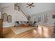 Spacious living room featuring a vaulted ceiling, large windows, and an open staircase to upper level at 1109 Wiley Bridge Rd, Woodstock, GA 30188