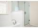 Bathroom with soaking tub and walk-in shower, updated fixtures at 875 Venture Sw Way, Atlanta, GA 30331