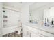 Main bathroom with tub shower combo and vanity at 875 Venture Sw Way, Atlanta, GA 30331