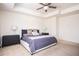 Large bedroom with king bed, ceiling fan, and neutral color palette at 875 Venture Sw Way, Atlanta, GA 30331