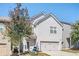 Two-story home with two-car garage and landscaping at 875 Venture Sw Way, Atlanta, GA 30331