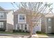 Two-story home with brick and siding, balcony, and landscaping at 875 Venture Sw Way, Atlanta, GA 30331