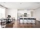 Modern white kitchen with island and hardwood floors at 875 Venture Sw Way, Atlanta, GA 30331