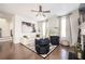 Living room with fireplace, hardwood floors, and large windows at 875 Venture Sw Way, Atlanta, GA 30331