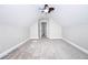 Attic space features finished carpeted flooring, bright walls, and open doorway at 116 Big Cotton Trl, Mcdonough, GA 30252