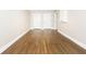Finished basement with wood flooring, white trim, and multiple doorways at 116 Big Cotton Trl, Mcdonough, GA 30252