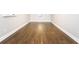 Finished basement with wood flooring and white trim accents at 116 Big Cotton Trl, Mcdonough, GA 30252