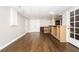 Partially finished basement with open layout with wood floors and drop ceiling offers potential for customization and expansion at 116 Big Cotton Trl, Mcdonough, GA 30252