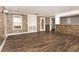 Spacious finished basement features wood flooring, stone-faced accents and wood-paneled walls at 116 Big Cotton Trl, Mcdonough, GA 30252