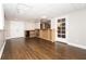 Spacious partially finished basement features a bar and wood-look flooring, offering potential for customization at 116 Big Cotton Trl, Mcdonough, GA 30252