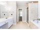 Well-lit bathroom with a vanity and combination shower and bathtub at 116 Big Cotton Trl, Mcdonough, GA 30252