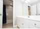 Well-lit bathroom featuring a vanity and combination shower and bathtub at 116 Big Cotton Trl, Mcdonough, GA 30252