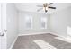 Bright, carpeted bedroom featuring two bright windows at 116 Big Cotton Trl, Mcdonough, GA 30252