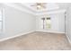 Spacious bedroom featuring neutral walls, carpet, and a ceiling fan at 116 Big Cotton Trl, Mcdonough, GA 30252