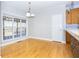 Bright dining area featuring hardwood floors and natural light from large windows at 116 Big Cotton Trl, Mcdonough, GA 30252