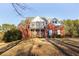 Beautiful two story brick home with a well-manicured front lawn at 116 Big Cotton Trl, Mcdonough, GA 30252