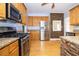 Modern kitchen showcasing granite countertops, stainless steel appliances, and custom cabinetry at 116 Big Cotton Trl, Mcdonough, GA 30252