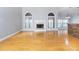 Bright and open living room with hardwood floors, fireplace and view into adjacent areas at 116 Big Cotton Trl, Mcdonough, GA 30252