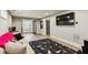 Open concept basement with a large sectional sofa and media area at 875 Berne Se St, Atlanta, GA 30316