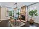 Spacious dining area with glass table, hardwood floors and fireplace at 875 Berne Se St, Atlanta, GA 30316