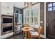 Kitchen breakfast nook with a round wooden table and chairs at 875 Berne Se St, Atlanta, GA 30316