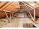 Unfinished attic space with exposed beams and plywood flooring at 3355 Old Peachtree Rd, Dacula, GA 30019