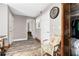 Home hallway with hardwood floors and built-in wooden closet at 3355 Old Peachtree Rd, Dacula, GA 30019