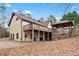 Back of house, deck, and gazebo, surrounded by trees at 3355 Old Peachtree Rd, Dacula, GA 30019