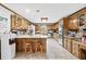 Galley kitchen with wood cabinets and ample counter space at 3355 Old Peachtree Rd, Dacula, GA 30019