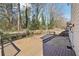 Large wood deck with multiple levels and views of the wooded backyard at 485 Kensington Parc Dr, Avondale Estates, GA 30002