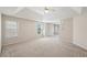 This large bedroom features a tray ceiling, ceiling fan and plenty of light at 485 Kensington Parc Dr, Avondale Estates, GA 30002