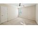 Bedroom features beige carpet, white door and a window with blinds at 485 Kensington Parc Dr, Avondale Estates, GA 30002