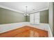 Cozy dining room featuring wainscoting, crown molding, and a contemporary chandelier at 485 Kensington Parc Dr, Avondale Estates, GA 30002